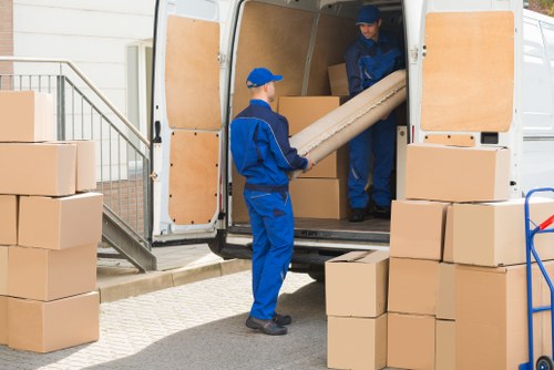 Man and van team preparing items safely before loading