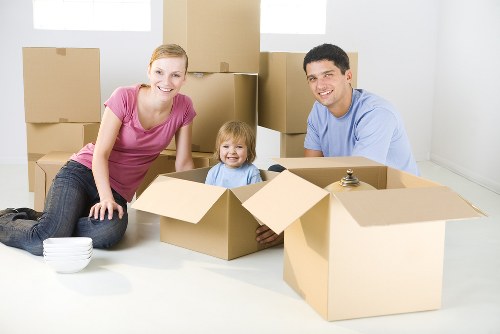 Removal van and moving team in a residential Tooting street