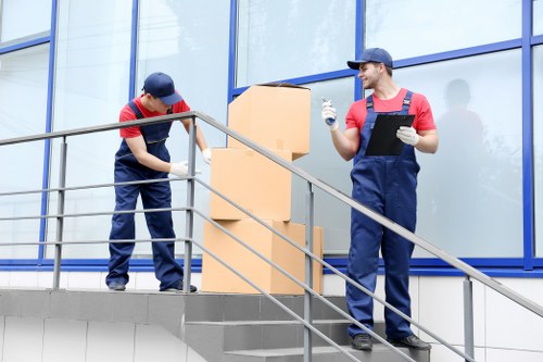 Office moving team preparing furniture for a business relocation in Tooting