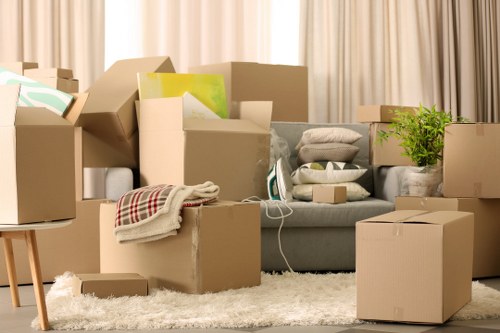Removalists carrying furniture from a Tooting home